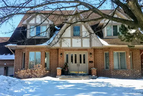 Brick family home on a Brampton street in winter