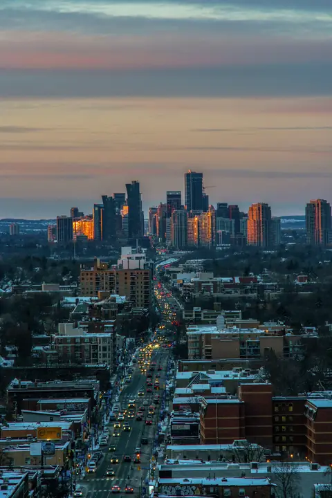 Evening traffic on a main street leading to the Mississauga City Centre towers